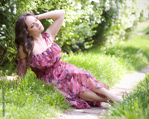 Photo: Beautiful woman in spring garden Beautiful woman in spring garden