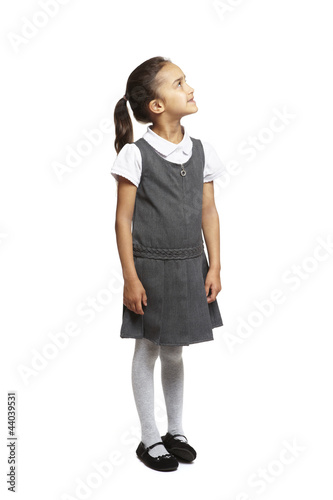 Photo: School girl looking up smiling School girl looking up smiling