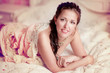 Photo: Stylish woman in a vintage dress in a luxurious interior Stylish woman in a vintage dress in a luxurious interior