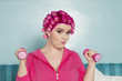 Photo: Portrait of a young woman exercising with dumbbell Portrait of a young woman exercising with dumbbell