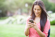 Photo: Hispanic college student texting Hispanic college student texting
