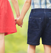 Children holding hands, first love or siblings concept