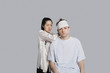 Female doctor dressing patient's head with bandage