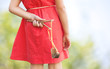 Naughty girl hiding slingshot behind her back