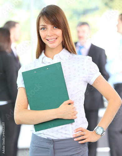 Photo: Closeup portrait of cute young business woman smiling Closeup portrait of cute young business woman smiling