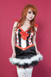 Portrait of teenage girl in dress over colored background