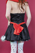 Back view torso of teenage girl in a dress over colored background