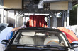 Employees wiping vehicle in car wash