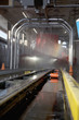 Foto: Motor vehicle going through a cleaning process in car wash Motor vehicle going through a cleaning process in car wash