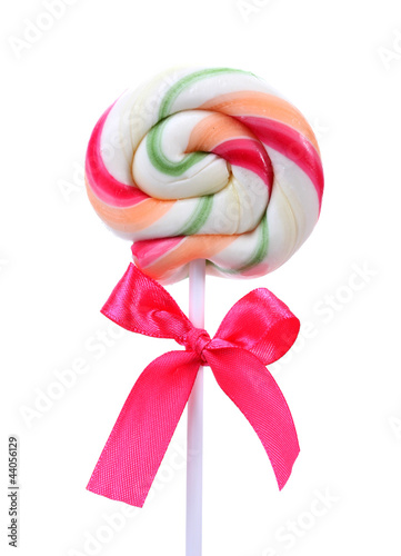 Foto: Colorful lollipop with bow isolated on white Colorful lollipop with bow isolated on white
