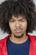 Portrait of a young man with raised eyebrow