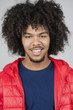 Portrait of a happy man with curly hair and goatee