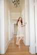Full length of an attractive young female standing in corridor