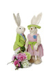 Female and male Rabbits with flower bouquet standing over white background