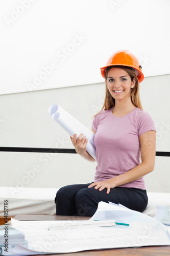Photo: Female Architect With Blueprint Female Architect With Blueprint