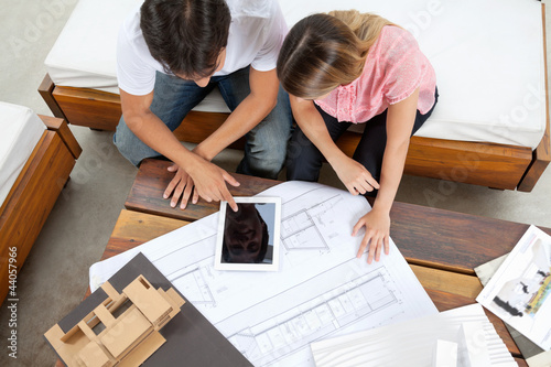 Photo: Couple With House Plans Couple With House Plans