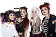 Photo: Portrait of all female band with microphone and boom box over white background Portrait of all female band with microphone and boom box over white background