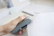 Close-up of man's hand stapling paper in office