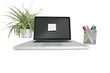 Smiley face sticky note on laptop with office supplies and pot plant