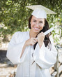 Photo: Graduating Mixed Race Girl In Cap and Gown with Diploma Graduating Mixed Race Girl In Cap and Gown with Diploma