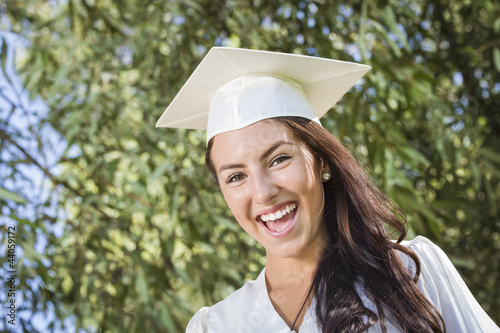 Photo: Happy Graduating Mixed Race Girl In Cap and Gown Happy Graduating Mixed Race Girl In Cap and Gown