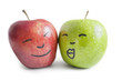 Photo: Red and green apples with face over white background Red and green apples with face over white background