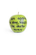 Photo: Close-up of sayings text on a juicy granny smith apple over white background Close-up of sayings text on a juicy granny smith apple over white background