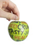 Photo: Cropped image of hand holding a granny smith apple with orthographic text over white background Cropped image of hand holding a granny smith apple with orthographic text over white background