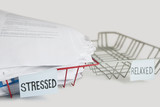 Photo: Stack of paperwork in stressed tray with empty relaxed platter over white background Stack of paperwork in stressed tray with empty relaxed platter over white background