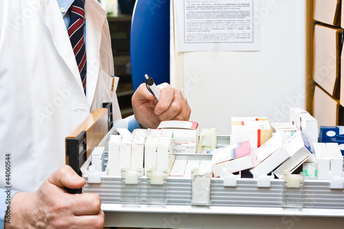 Photo: Pharmacist searching for a medicine Pharmacist searching for a medicine