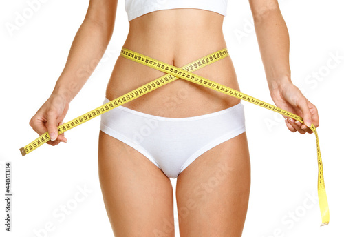Photo: woman measuring perfect shape of beautiful thigh healthy lifesty woman measuring perfect shape of beautiful thigh healthy lifesty