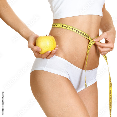 Photo: Woman measuring her waistline. Perfect Slim Body. Diet Woman measuring her waistline. Perfect Slim Body. Diet