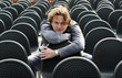 The man sits on a chair