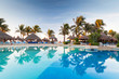 Tropical swimming pool at sunrise in Mexico