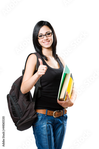 Photo: Beautiful young student girl showing thumbs up. Beautiful young student girl showing thumbs up.