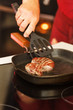 beef steak in a frying pan