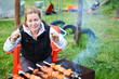 Photo: Hungry woman with fork and knife in hands waiting for meat Hungry woman with fork and knife in hands waiting for meat