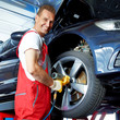 Tyre fitting with new alu rim in a garage