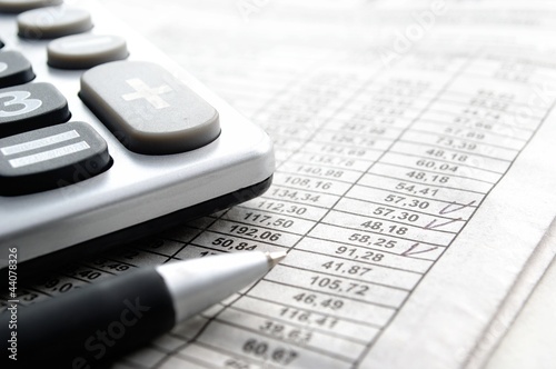 Photo: calculator and stationery items on the table calculator and stationery items on the table