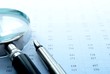 chart and a magnifying glass on the table,