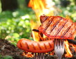 Sausage and steak on a fork.