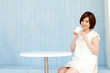 Beautiful young business woman drinking tea