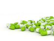 Photo: Green pills on white background Green pills on white background