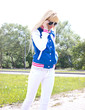Beautiful blonde woman walking on the street
