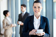 young businesswoman having coffee break at work