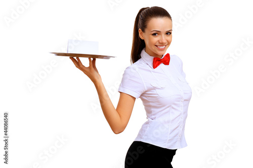 Photo: Young waitress with an empty tray Young waitress with an empty tray