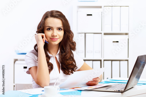 Photo: Business woman in office Business woman in office