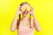 young girl holding lemons