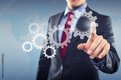 Photo: Man with Touchscreen cogwheels Man with Touchscreen cogwheels