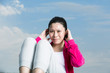 Chinese woman doing situps in park.